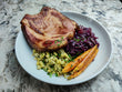 Smoked Local Pork Chop with Beer Braised Purple Cabbage, Herb Spätzle, Maple Glazed Carrots