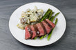 AAA Canadian Striploin or Sea Bass with Roasted Asparagus and German Potato Salad